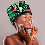 Smiling woman wearing a floral print portable electric hair steamer cap for deep conditioning and hair repair